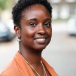Head-shot of curly black woman.